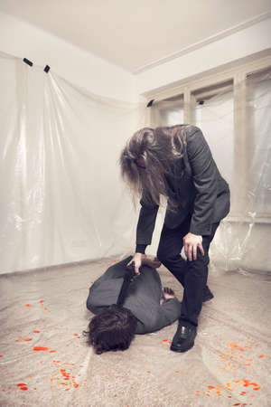 Liquidation of the drug dealer by cheated client in empty apartmentの写真素材