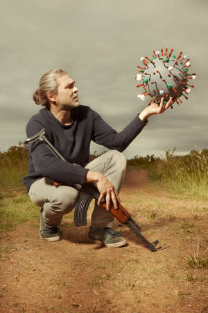 Armed man in civilian style catching virion of coronavirus