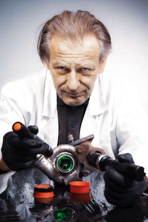 Man checking and measuring carbonized turbocharger on table