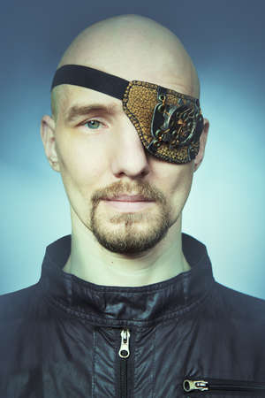Young man in style of steampunk icon with eye patch