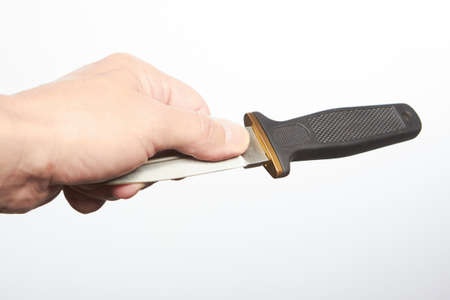Styles of grip for throwing weapons - detail of hand grip of small dagger