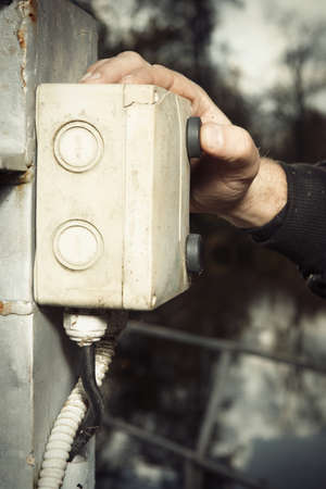 Worker during launching micro hydropower plant on small riverの写真素材