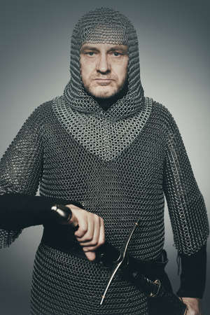 Medieval infantry armed man dressed in chain armorの写真素材