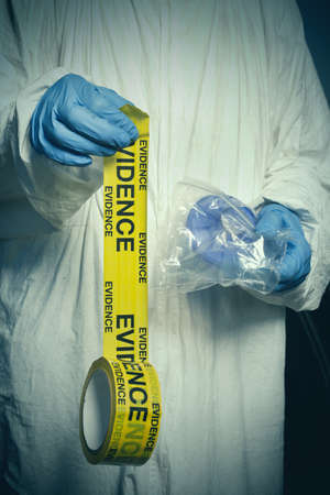 Criminologist technician sealing evidence from vacuum and micro filter