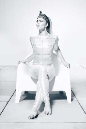 Fitness beauty in costume of Egypt princess posing outdoorの写真素材