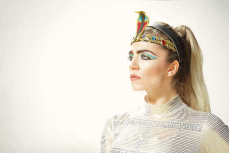 Fitness beauty in costume of Egypt princess posing outdoorの写真素材