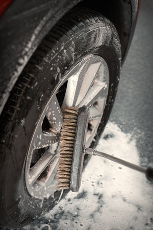 Details of cleaning car parts in self service car wash boxの写真素材