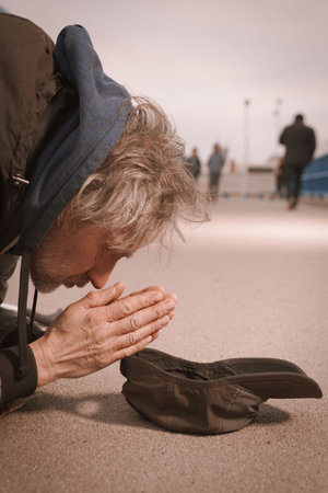 Senior citizen beggar on city overpass begging for some money