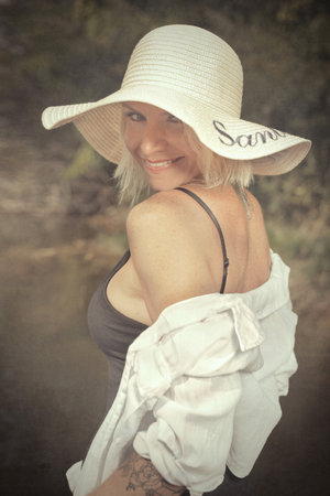 Pretty lady posing for portrait in daytimeの写真素材