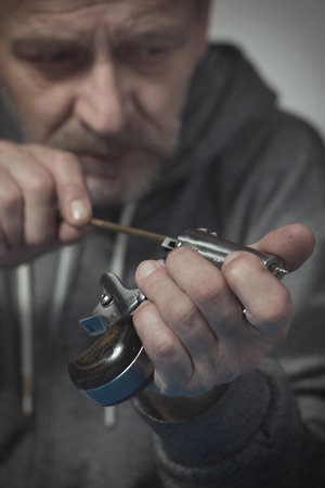 Man takes care of two barrel derringer personal handgun caliber .38 special