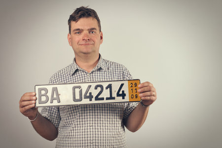 Man in studio on gray background posingの写真素材