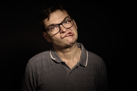 Man in glasses and shirt with doing expressionsの写真素材