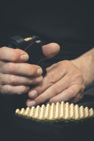 Loading pistol and handling with semiautomatic 9 mm pistol detailsの写真素材