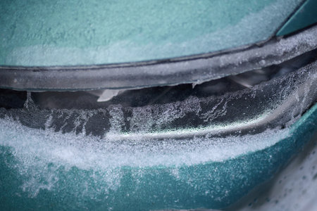 Details of cars frozen in calamity ice on street of European city Prague
