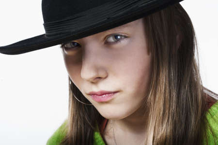 studio portrait of a pretty, eleven years old girl