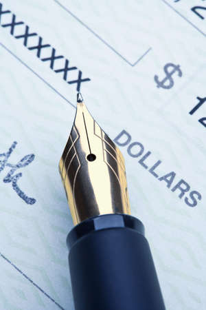 extreme closeup of a fountain pen and checkの写真素材