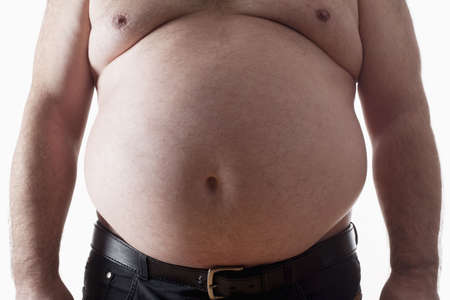 big belly of a fat man isolated on whiteの写真素材