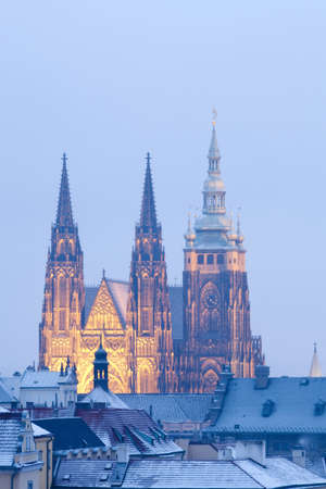 prague in winter - lesser town roofs and hradcany castle at duskの写真素材