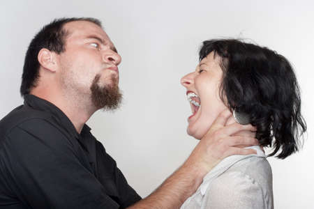 couple fighting, man abusing the woman - isolated on whiteの写真素材