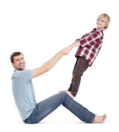 father and son having fun fooling around with each other - isolated on whiteの写真素材