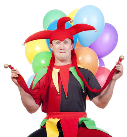 jester - entertaining figure in typical costume with colorful balloonsの写真素材