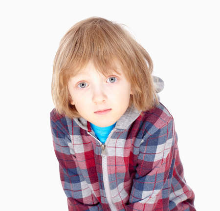 portrait of a boy with blond hair - isolated on whiteの写真素材