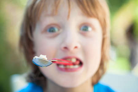 Boy Eating, Fooling Around with Forkの写真素材