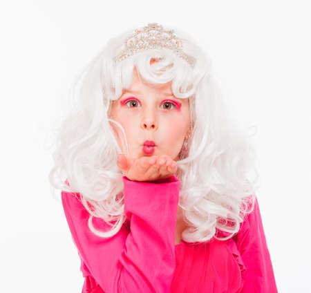 Young Girl in White Wig and Diadem Posing as Princessの写真素材