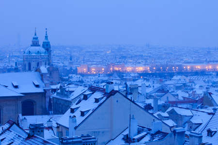Prague - St. Nicolas church and rooftops of Mala Strana in winterの写真素材