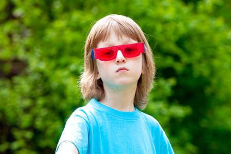 Portrait of a Boy with Funny Red Glasses Lookingの写真素材