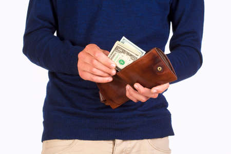 Man Holding a Wallet and Counting Dollar Bills