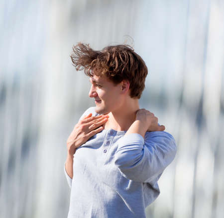 Young Man Standing on the Bridge Lookingの写真素材