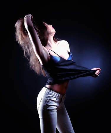 Dramatic Portrait of a Teenage Girl with Long Brown Hair の写真素材