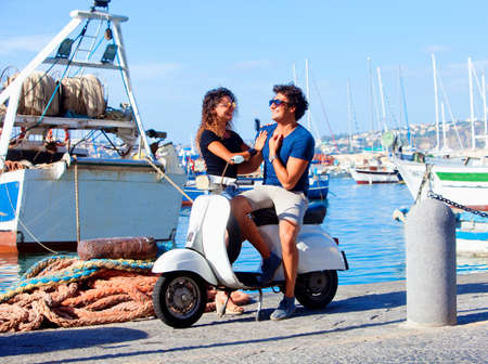 Young Italian Couple on Scooter Having Fun