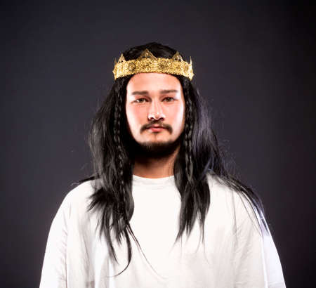 Portrait of a King with Crown and Dark Hair.