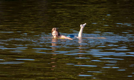 Boy Enjoying Swimming in the Lake Smilingの写真素材