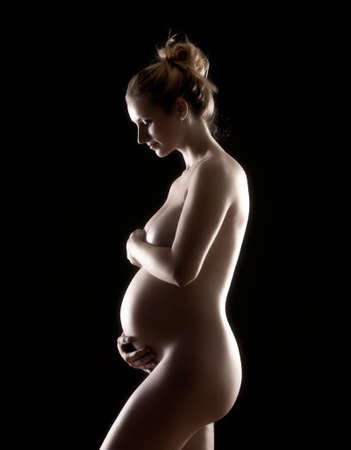 Studio Portrait of a Pregnant Blond Womanの写真素材