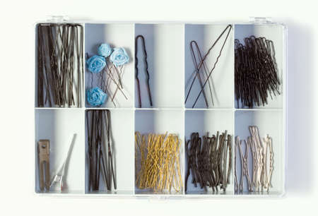 Fixing Hair  Pins in a Plastic Box on White Backgroundの写真素材