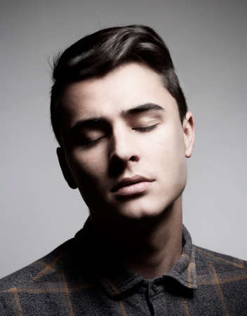 Studio Portrait of a Teenage Boy in Shirt.の写真素材