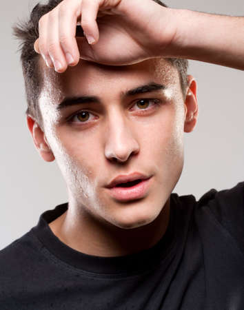 Portrait of a Teenage Boy with Sweat on his Face.の写真素材