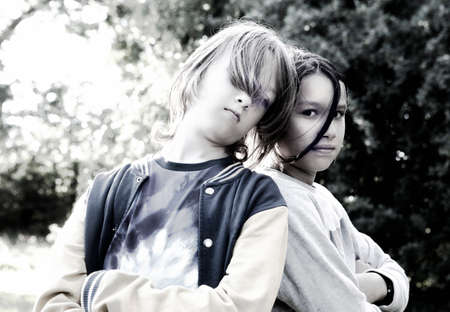 Portrait of a Two Boys with Long Hair in the Garden