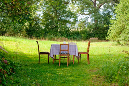 Picnic table and chairs in the garden.の写真素材