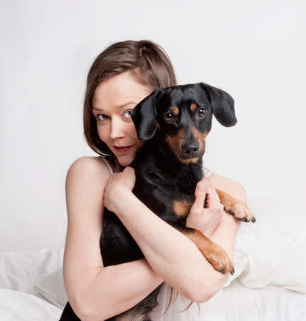Portrait of a Woman with Brown Hair and her Dog.の写真素材