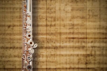 Flute Middle Joint/14 K Rose Gold/ On MUSIC Sheet Background の写真素材