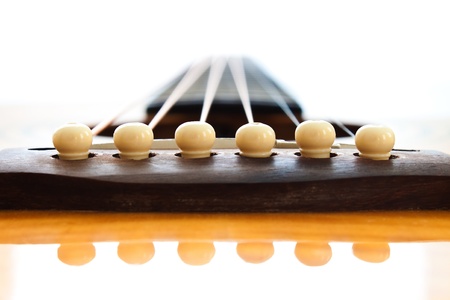 Acoustic Guitar/Closeup at the pins on the bridge の写真素材