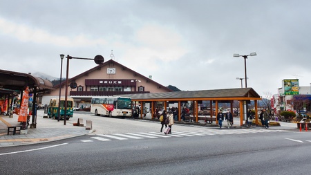 NIKKO, JAPAN - MARCH 24  In front of Nikko Tourist Information Center locates a loop bus station, loop bus takes people up to all Nikko s world heritage sites  on March 24, 2012 in Nikko, Japan のeditorial素材