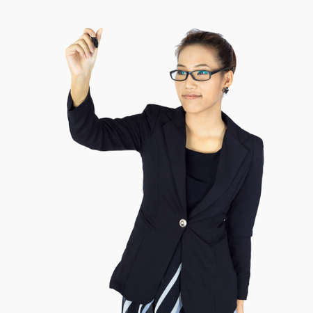 Isolated Young  Business woman uses cell phone on whiteの写真素材