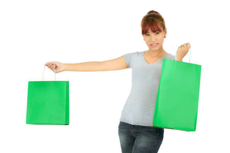 Isolated Young Asian woman with Green Shopping Bagsの写真素材