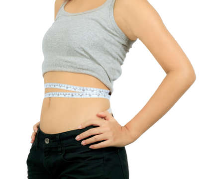 Isolated young slim asian woman on whiteの写真素材
