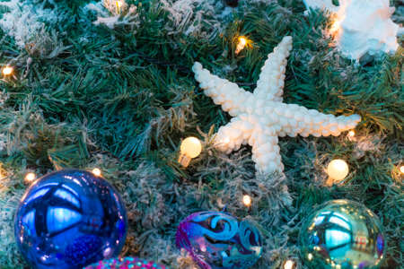 Variuos colorful ornaments decorated on a christmas treeの写真素材